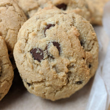 Load image into Gallery viewer, A close up of the perfect chocolate chip cookie waiting to be sent as an eco-friendly gift
