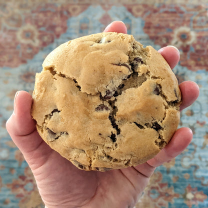 a chocolate chip cookie as big as a hand
